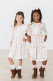 PRETTY PUMPKINS RUFFLE TWIRL DRESS