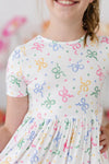 TIED IN LOVE SHORT SLEEVE POCKET TWIRL DRESS